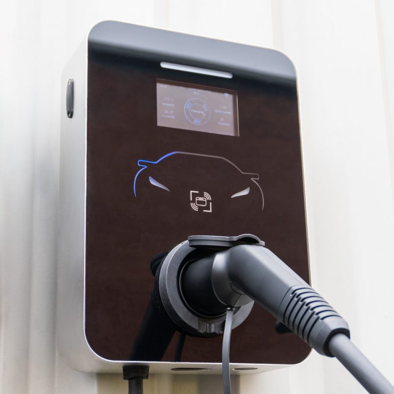 Wall Mounted Smart EV Charger with charger plugged in